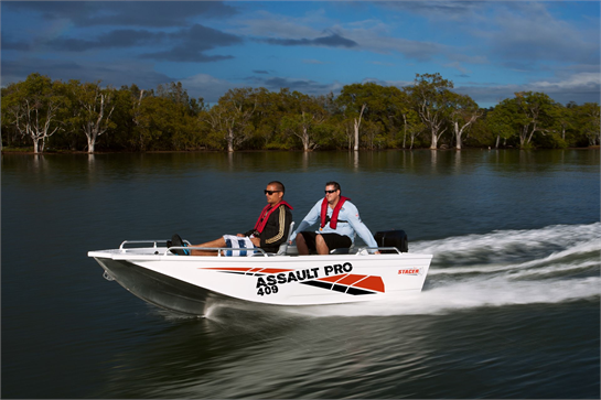 409 Assault Pro Tiff small boat gliding in shallow water ideal for fishing and other water activities