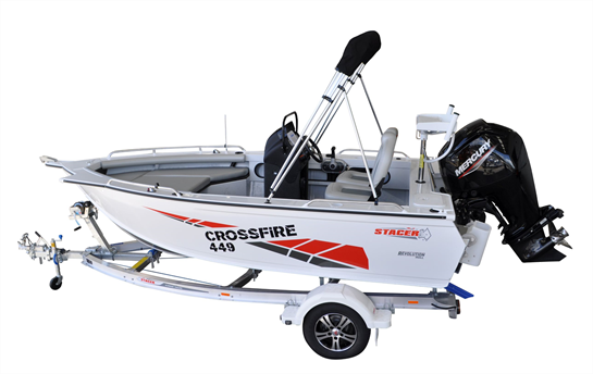 white stacer crossfire 449 anchored with a black outboard on a boat trailer